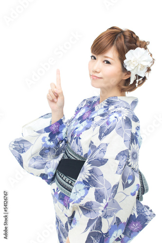 Photo: Beautiful young woman wearing japanese traditional kimono Beautiful young woman wearing japanese traditional kimono