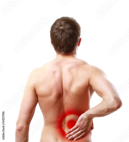 Photo: Young man having pain in his back, isolated on white background Young man having pain in his back, isolated on white background