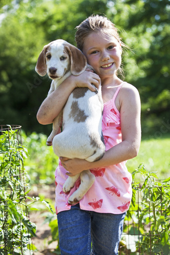 Photo: Young girl holding a puppy Young girl holding a puppy