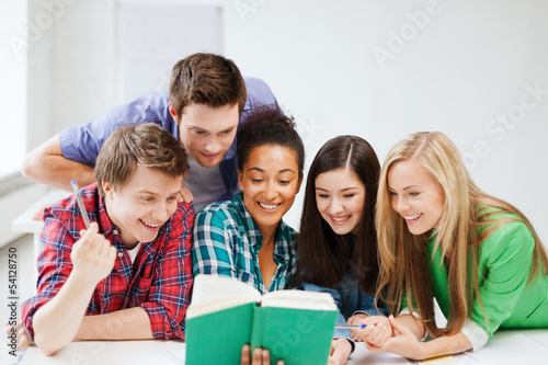 Photo: students reading book at school students reading book at school