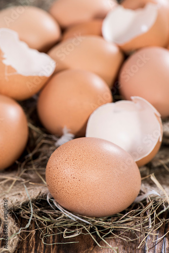 Photo: Fresh Eggs on wooden background Fresh Eggs on wooden background