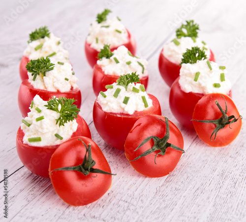 Photo: stuffed tomato with cheese stuffed tomato with cheese