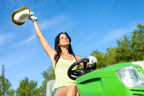 Photo: Happy gardener working with garden tractor Happy gardener working with garden tractor