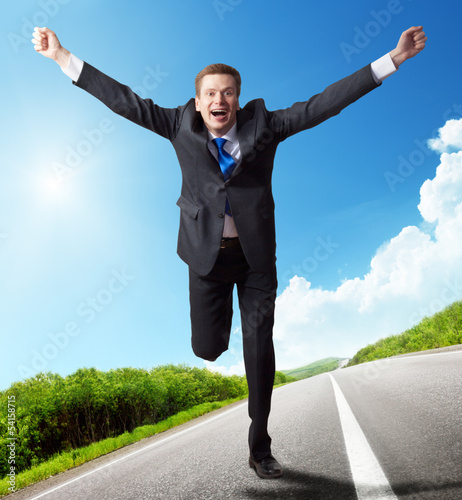 Photo: business man run on the road business man run on the road