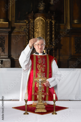 Photo: Blessing during catholic mass Blessing during catholic mass