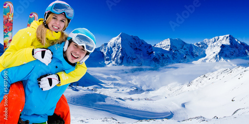Photo: Skiing, winter sports - couple having fun on ski Skiing, winter sports - couple having fun on ski
