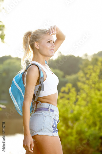 Photo: beautiful girl hiking outdoors leading a healthy lifestyle beautiful girl hiking outdoors leading a healthy lifestyle