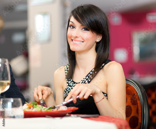 Photo: Woman having a dinner at the restaurant Woman having a dinner at the restaurant