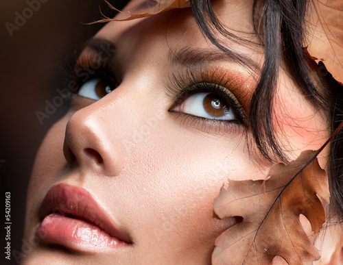Photo: Autumn Woman Fashion Portrait. Fall Autumn Woman Fashion Portrait. Fall