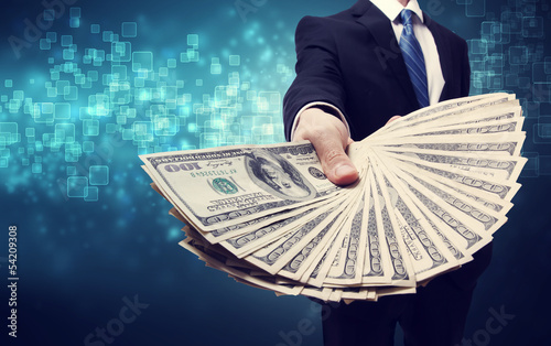Photo: Business Man Displaying Spread of Cash Business Man Displaying Spread of Cash
