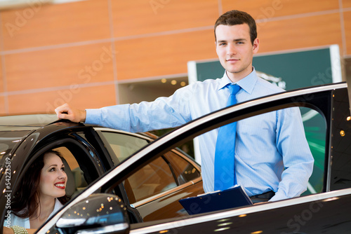Photo: Consultant in the showroom and the buyer Consultant in the showroom and the buyer