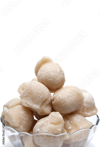 Photo: coconut palm sugar on white background coconut palm sugar on white background