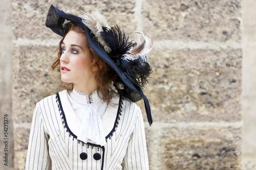 Photo: Old-fashioned dressed woman with wandering gaze Old-fashioned dressed woman with wandering gaze