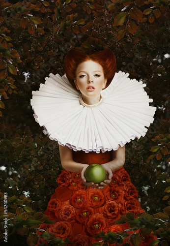 Photo: Vintage. Stylized Red Hair Woman in Retro Jabot with Green Apple Vintage. Stylized Red Hair Woman in Retro Jabot with Green Apple