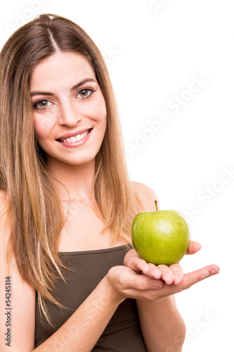 Photo: Portrait of a young woman eating green apple Portrait of a young woman eating green apple