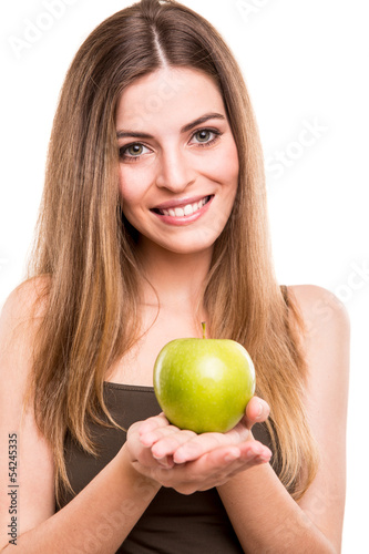 Photo: Portrait of a young woman eating green apple Portrait of a young woman eating green apple