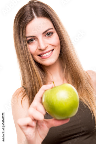 Photo: Portrait of a young woman eating green apple Portrait of a young woman eating green apple