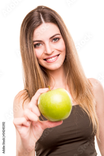 Photo: Portrait of a young woman eating green apple Portrait of a young woman eating green apple