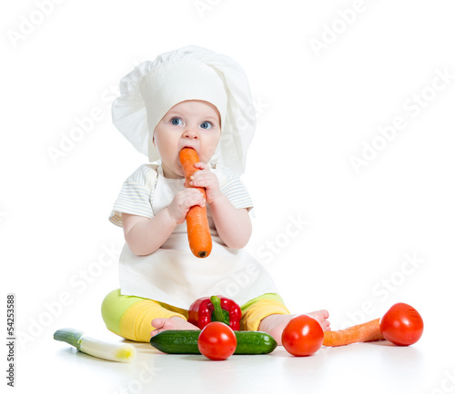 Photo: cook baby girl eating healthy food isolated on white cook baby girl eating healthy food isolated on white