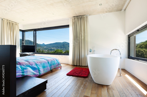 Photo: Modern villa, interior, bedroom with bathtub Modern villa, interior, bedroom with bathtub