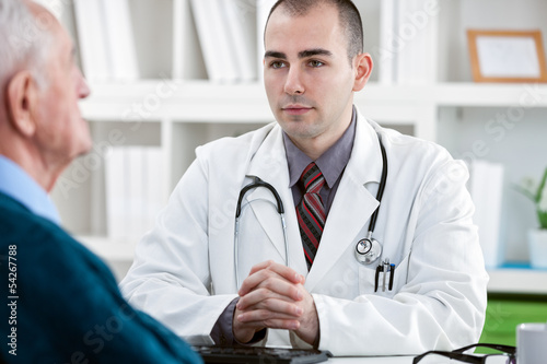 Photo: doctor talking to patient doctor talking to patient