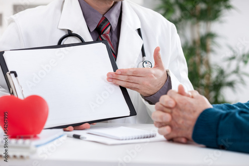 Photo: Cardiologist showing medical test Cardiologist showing medical test