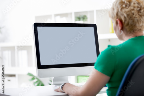 Photo: woman working of a computer woman working of a computer