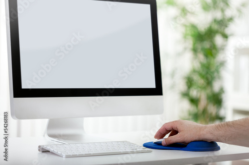 Photo: Men hand using computer mouse Men hand using computer mouse