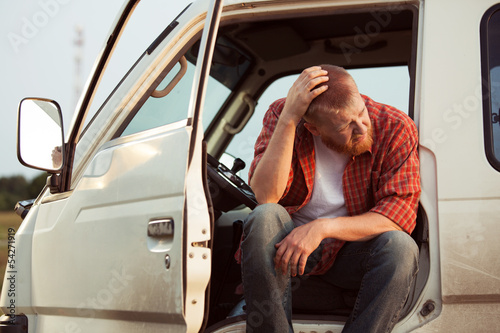 Photo: Driver of the car is sitting thinking Driver of the car is sitting thinking