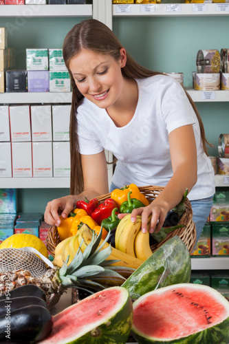 Photo: Woman Shopping Fruits And Vegetables In Supermarket Woman Shopping Fruits And Vegetables In Supermarket