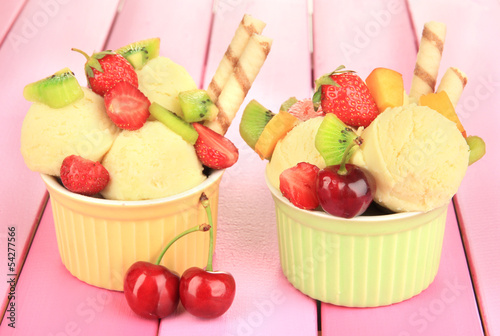 Photo: Delicious ice cream with fruits and berries in bowl Delicious ice cream with fruits and berries in bowl