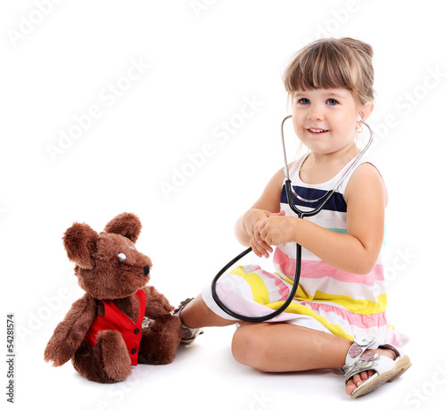 Photo: Little cute girl playing doctor, isolated on white Little cute girl playing doctor, isolated on white