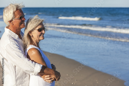 Photo: Happy Senior Couple Looking To Sea on A Tropical Beach Happy Senior Couple Looking To Sea on A Tropical Beach