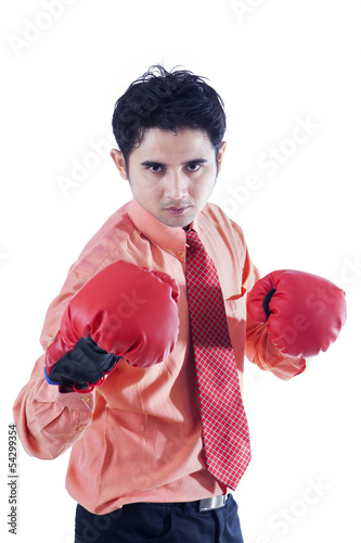 Photo: Businessman and boxing gloves on white Businessman and boxing gloves on white