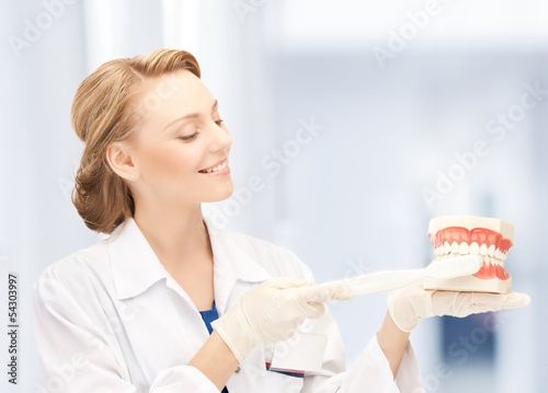 Photo: doctor with toothbrush and jaws in hospital doctor with toothbrush and jaws in hospital