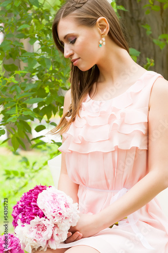 Photo: Attractive woman with flowers Attractive woman with flowers
