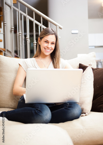 Photo: Woman using a laptop Woman using a laptop