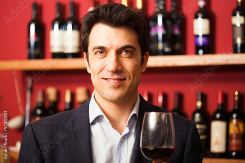 Photo: Sommelier tasting a wine glass Sommelier tasting a wine glass