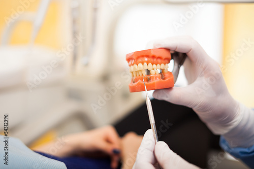 Photo: Dentist explaining a treatment Dentist explaining a treatment
