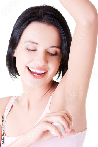 Photo: Beautiful young woman using antiperspirant Beautiful young woman using antiperspirant