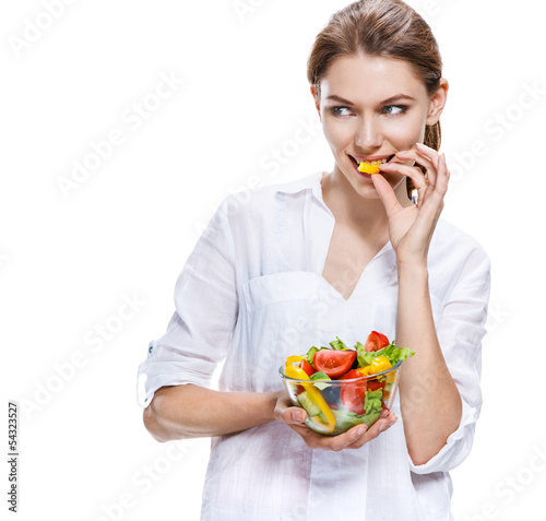 Photo: flawless european woman & raw vegetable salad - isolated flawless european woman & raw vegetable salad - isolated
