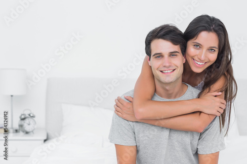 Photo: Woman embracing her partner Woman embracing her partner