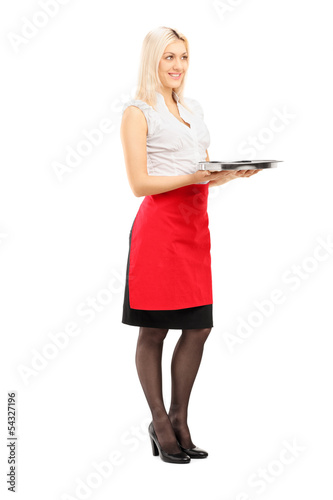 Photo: Full length portrait of a smiling blond female waitress holding Full length portrait of a smiling blond female waitress holding