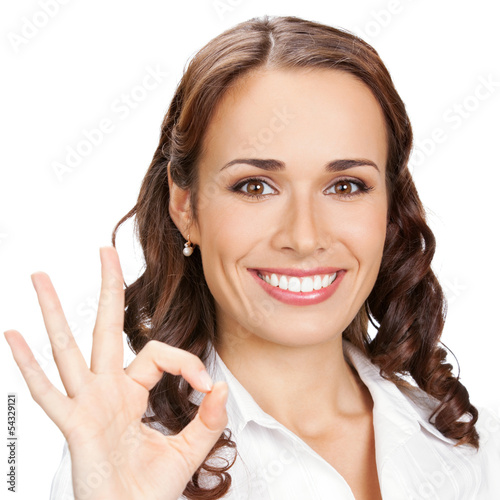 Photo: Businesswoman with okay gesture, isolated Businesswoman with okay gesture, isolated