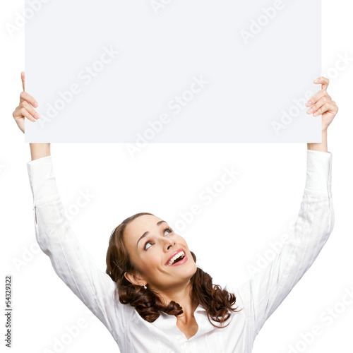 Photo: Happy businesswoman showing blank signboard Happy businesswoman showing blank signboard