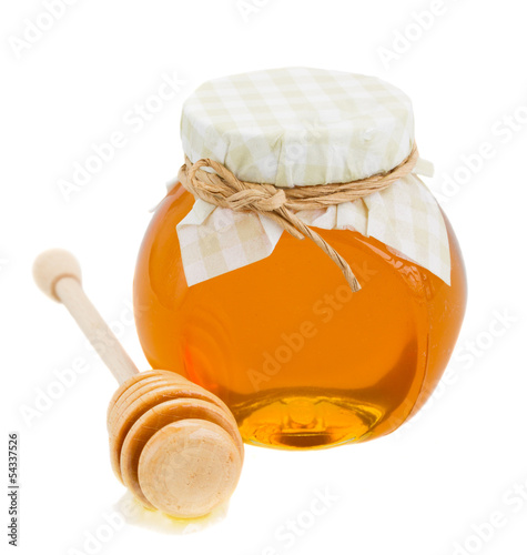 Photo: honey in glass pot and stick honey in glass pot and stick