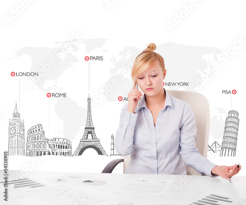 Photo: Beautiful businesswoman with world map and major landmarks of th Beautiful businesswoman with world map and major landmarks of th