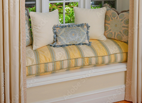 Photo: seating area in a bay window with decorative pillows and cushion seating area in a bay window with decorative pillows and cushion