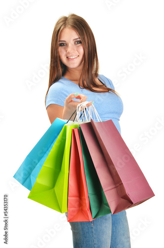 Photo: Young happy woman with colorful paper shopping bags isolated Young happy woman with colorful paper shopping bags isolated