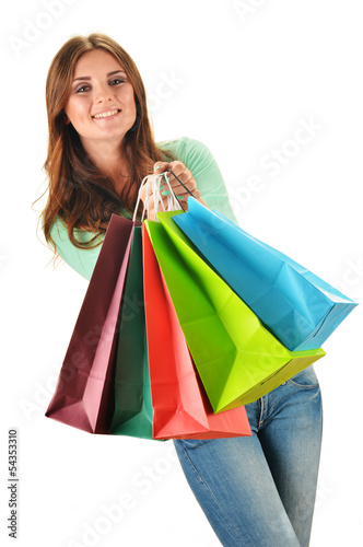 Photo: Young happy woman with colorful paper shopping bags isolated Young happy woman with colorful paper shopping bags isolated